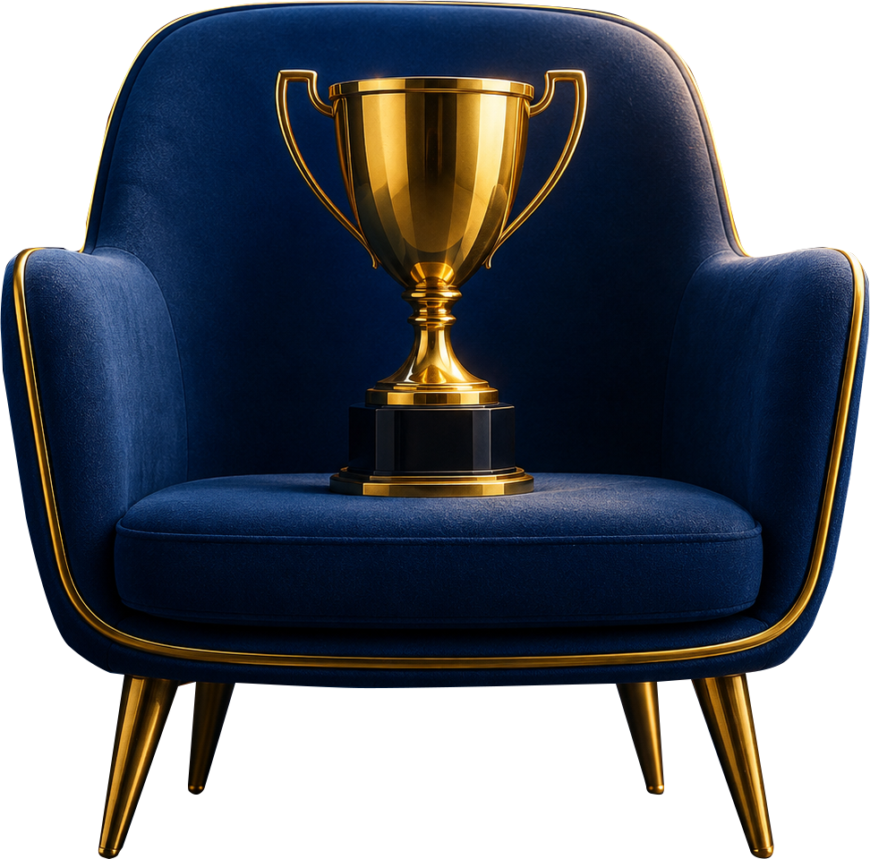 A gold trophy on a navy velvet armchair